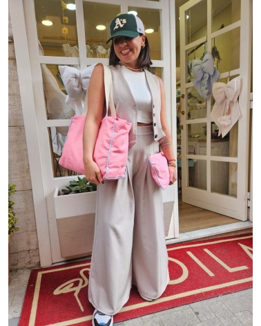 Odette con zip rosa baby profilo turchese